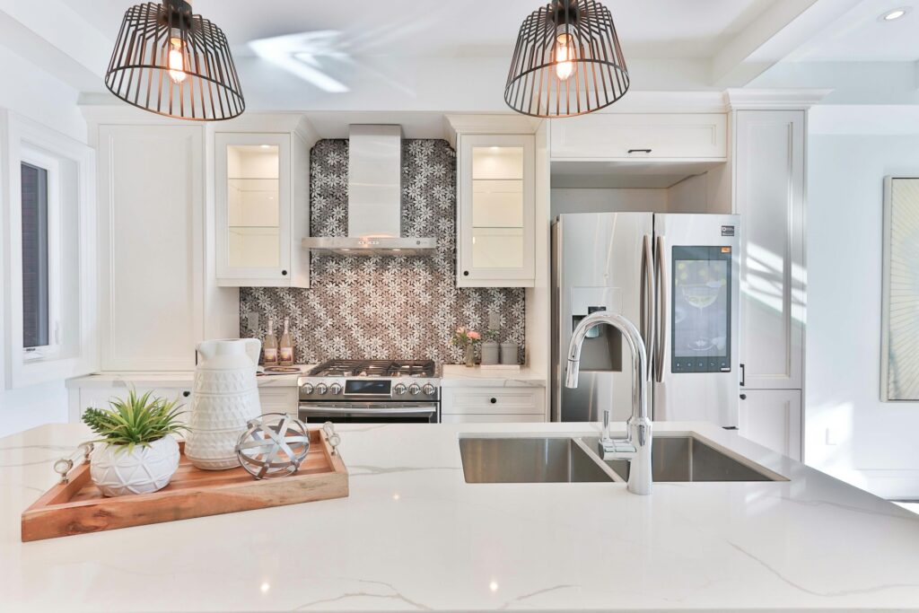 Spotless kitchen with white cabinets and countertops